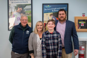 Spaulding student smiling with staff
