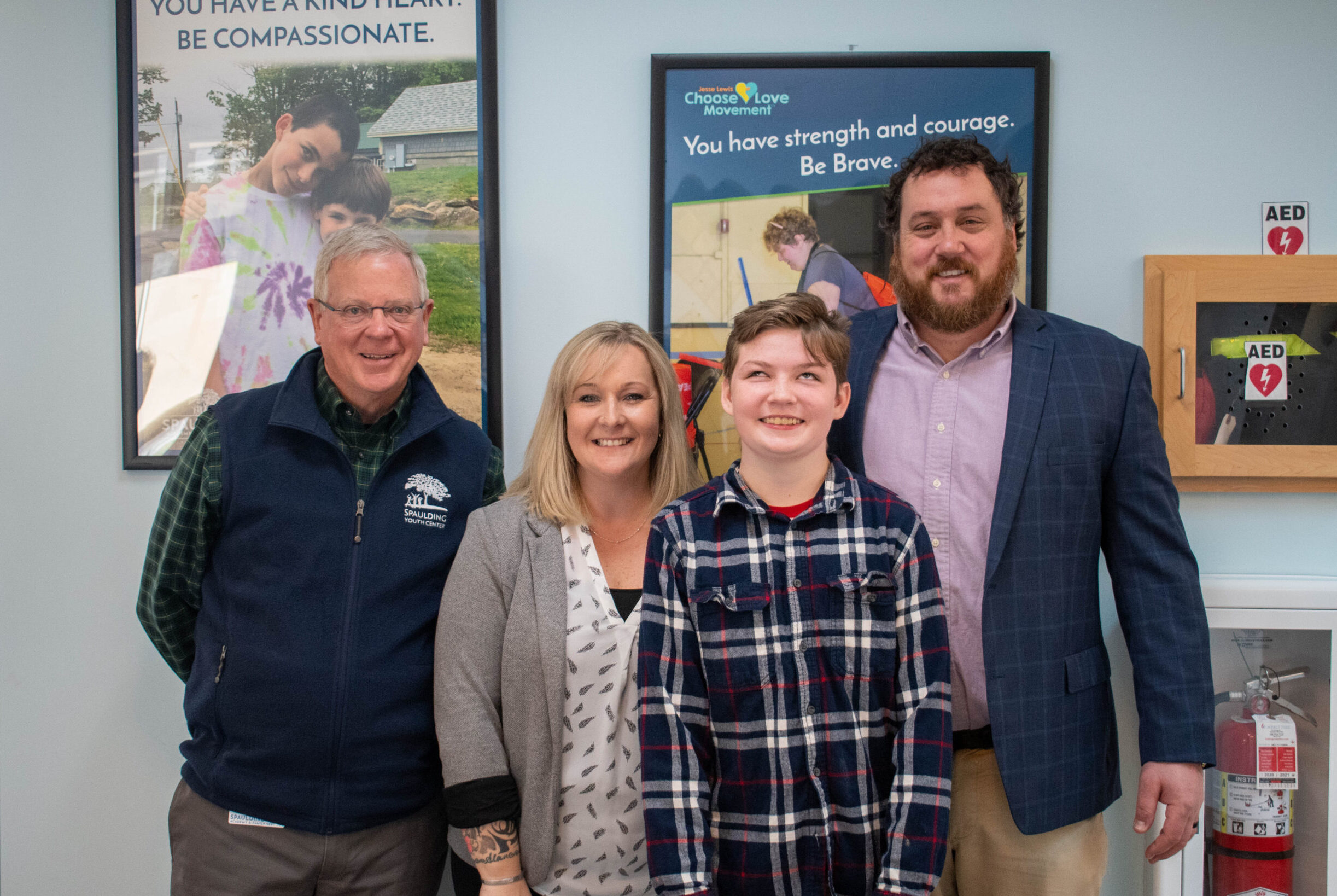 Spaulding student smiling with staff