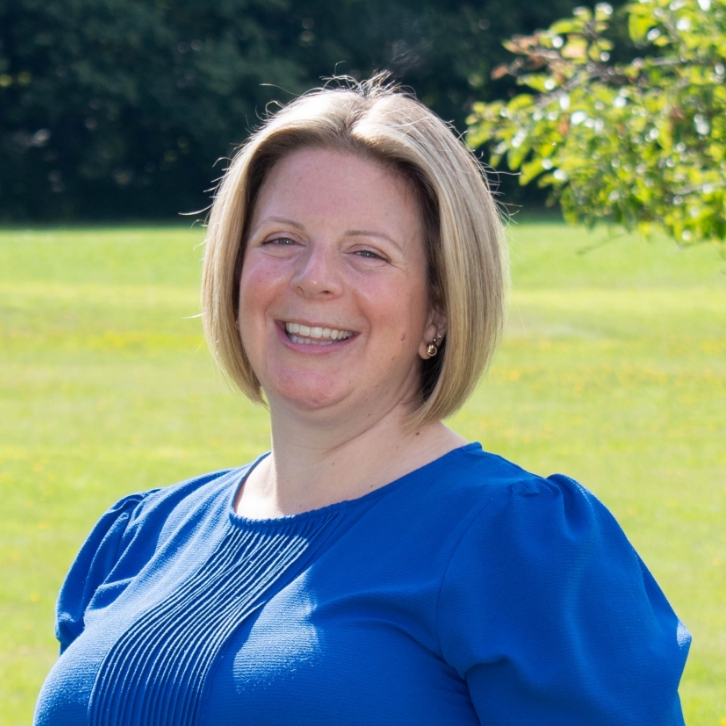 Staff member Meaghan Emmons smiles in headshot photo