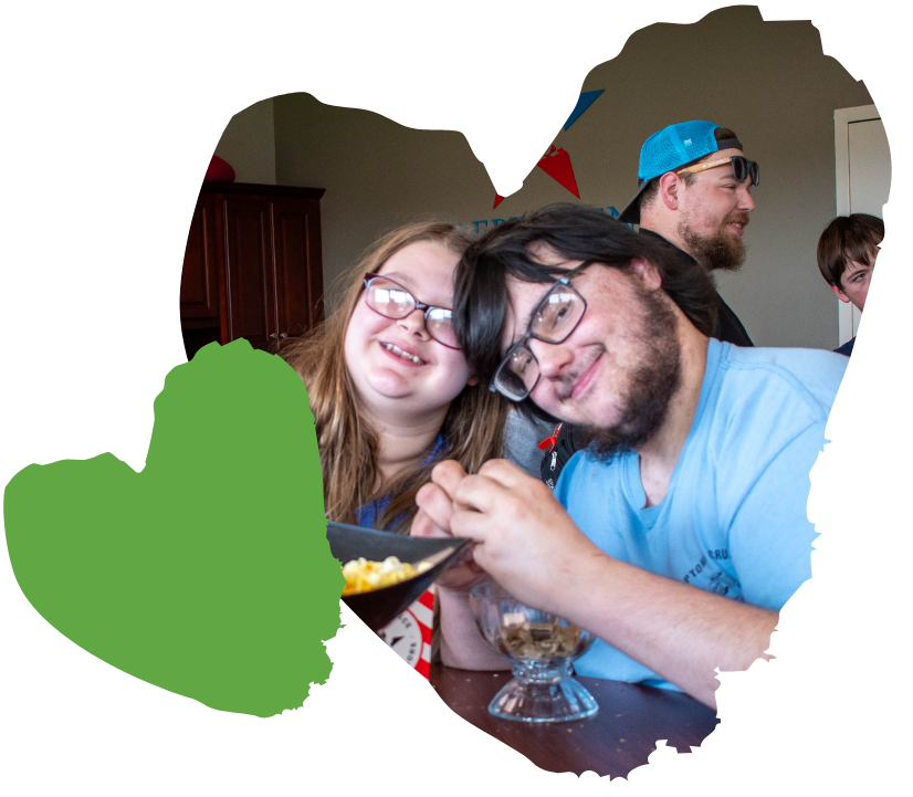 Two smiling children holding a bowl, emanating the warmth often seen in successful clinical services.
