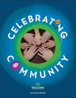 A circle of diverse hands touch in the center, surrounded by the words Celebrating Community.