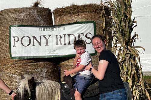IMG_0233 Foster mother and son pose for photo during pony ride